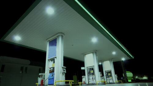 Petroleum gas station pumps at night