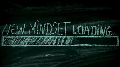 A chalkboard that says New Mindset Loading