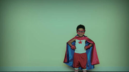 A boy dressed as a super hero