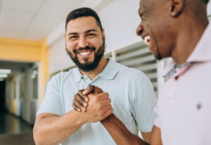 Two business professionals laughing