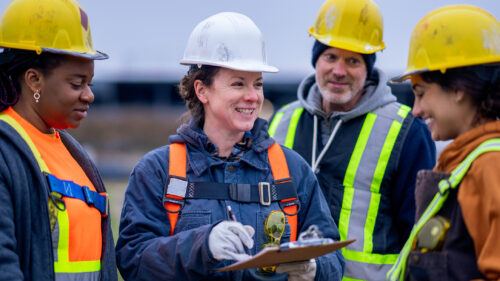 People on a construction site talking.