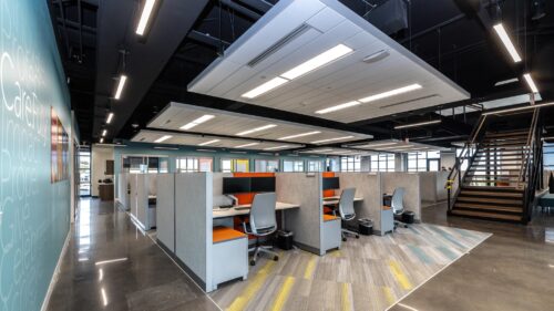 Sioux Falls office showcasing the company branding on the walls and working cubicles.