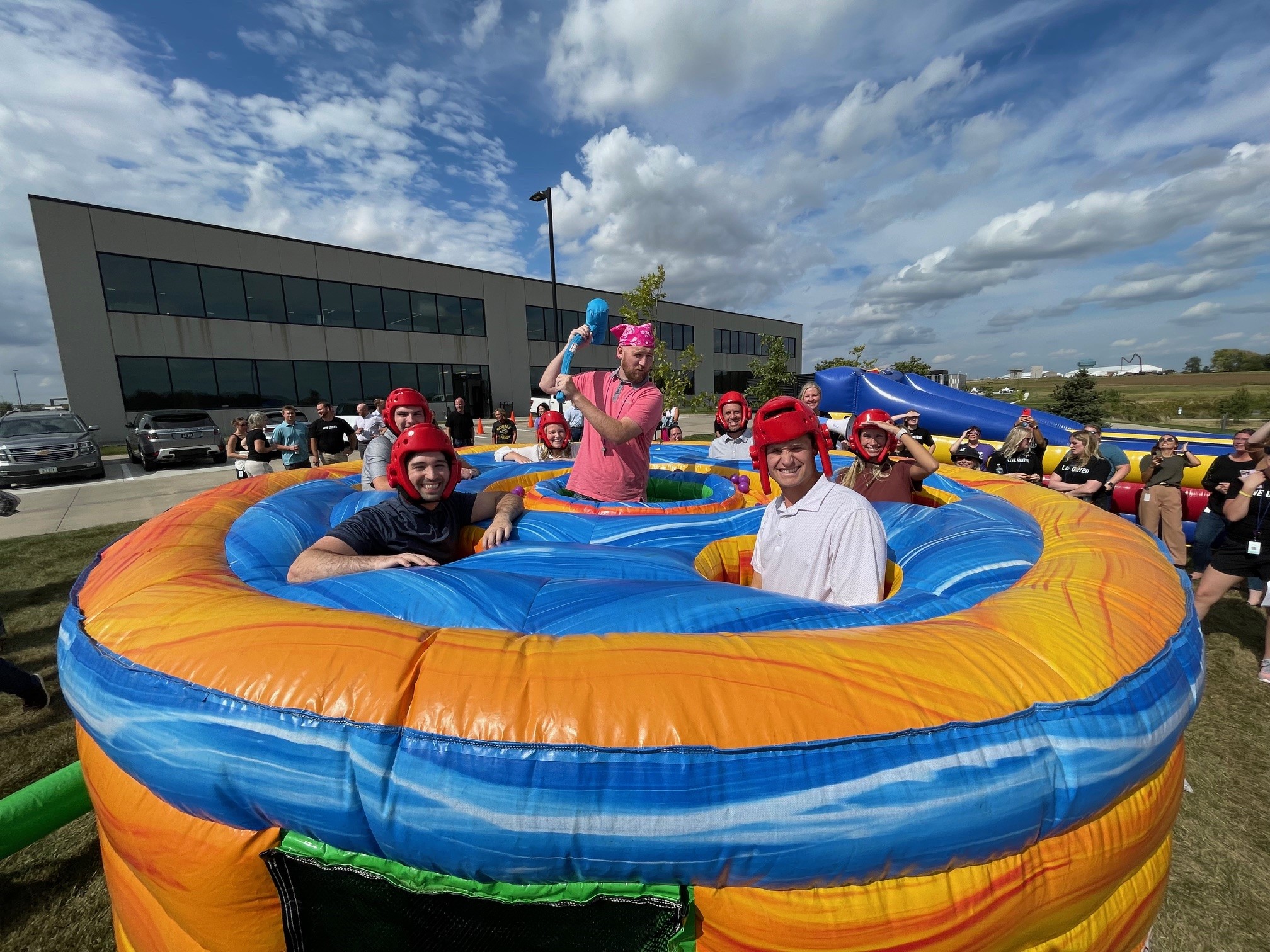 Waukee employees in a blowup human wack-a-mole game