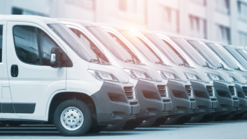 A fleet of company vehicles lined up